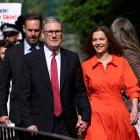 Britain's opposition Labour Party leader Keir Starmer and his wife Victoria walk outside a London...