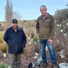 Waihao Downs farmer Kieran Henshaw (left), with Alfred the dog, and Roger Small, of Willowbridge,...