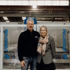 AGB co-owners Cam and Christine Paranthoiene stand in front of a five-axis bridge saw, which uses...