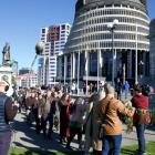 People march to Parliament prior to the public release of the abuse in care inquiry report. Photo...