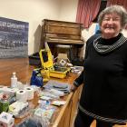 Roxburgh resident Margaret Card checks out the emergency kit items at a meeting in Roxburgh...
