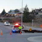 Emergency services work at the place where a cyclist was seriously injured and then died, after...