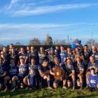 The Wyndham rugby team celebrate winning the Ack Soper Shield on Saturday after beating Pioneer...