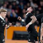 Damian McKenzie and an in pain T J Perenara. Photo: Getty Images 