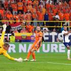 Ollie Watkins watches as his last minute shot goes past Dutch keeper Verbruggen to send England...