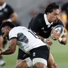 All Black Billy Proctor collides with Fiji’s Vilimoni Botitu during the one-off test at...