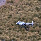 The crashed Squirrel helicopter at the mouth of the Paringa River on Saturday. PHOTO: SUPPLIED 