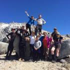 Lulu Sun (top left) on Mt Titiroa in Fiordland, with family and friends, and bush guide and Otago...