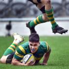 Green Island centre Levi Harmon dives over for a try. PHOTOS: PETER MCINTOSH