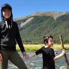 A younger Lulu Sun, pictured with her younger brother, Quintin, having fun in the wilderness of...