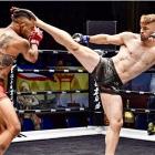 Jack Ferguson kicks out in a competitive mixed martial arts fight in Thailand.