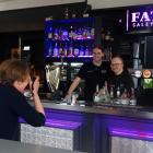 Bridgit Anderson photographs Ben Johnston and Tess McAtamney during their shift at Fat Sally’s...