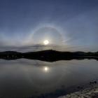 The 22° halo is reflected in the water at Portobello. Photo: Ian Griffin