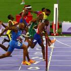 Noah Lyles (lane 6) crosses the line to win gold in the men's 100 metres. Photo: Reuters