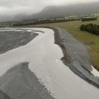 A stopbank system on the Waiho River's south bank protects the farming area. PHOTO: GREYMOUTH STAR