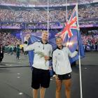 Finn Butcher and Dame Lisa Carrington fly the flag for the New Zealand team in Stade de France at...