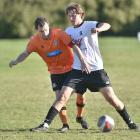 Cameron McPhail (Northern, left) and Joshua Marshall (Roslyn-Wakari) compete for possession at...