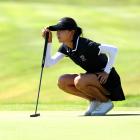 Lydia Ko lines up a putt on the unforgiving greens at Le Golf National, near Paris. Photo: Getty...