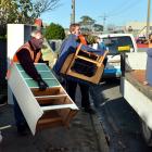 Flood-damaged furniture is removed from a Nelson St house following the 2015 South Dunedin flood....