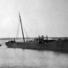 Retired steamship Te Anau rests on the harbour bed at Whanganui, after being towed from Dunedin...