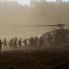 Israel's military evacuate injured people by helicopter after an anti-tank missile was fired into...