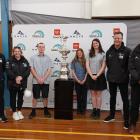 Posing with the America's Cup at Mount Aspiring College (MAC) on Tuesday afternoon are (from left...