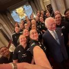 Britain's King Charles III poses for a photograph with members of New Zealand's Black Ferns rugby...