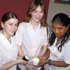 Student scented-candle businesswomen (from left) Megan Park, Pagan Buchanan and Jacklyn Wakeham ...