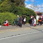 People walk towards Invercargill’s Queens Park on Saturday during a hīkoi that started from...