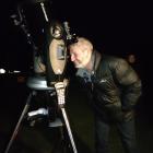 Kaikōura Mayor Craig Mackle looks at the moon through a telescope for the first time. Photo:...