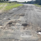 Potholes blight New Zealand's local roads, such as this one in Northland. Photo: Facebook...