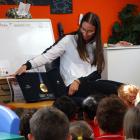 Kayaker Olivia Brett shows off her Olympic gold medal to the pupils at Five Forks School...