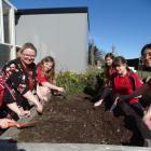 Totara School pupils (from left) Amelia Walsh, 6, teacher aide Jenny Hardwick, Allysra Currie, 9,...