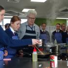 New St Kevin’s College food technology teacher Trevor Griggs helps his students prepare a dish....