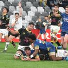 Otago openside flanker Lucas Casey shows his delight as he crosses for a try against Wellington...