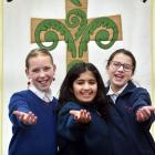 St Mary’s Kaikorai School pupils (from left) Ngaika Rapsey, Olivia Reju and Alyssa Kubala sing...