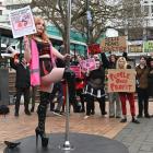 Ex-Stiletto’s stripper Kitten Pasta swings on a pole in the Octagon to protest against conditions...