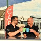 Leandro Massariolo (left) and John Tomkins celebrate opening the only cafe in Tapanui. Photo:...