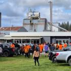 Workers heading into a Winstone Pulp International meeting after news of the closure of two of...