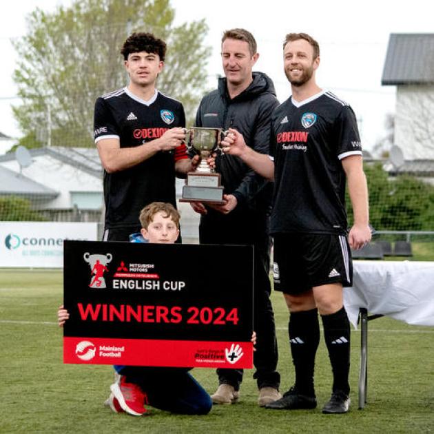 Captain Dominic McGarr (right) and vice-captain Joe Hoole are presented with the cup. PHOTO:...