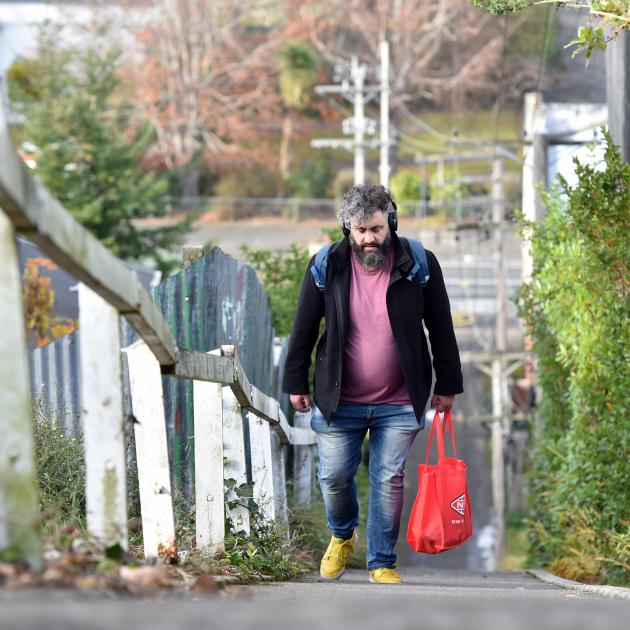 Simeon Snyder takes a shortcut up  Duddingstone Steps from North Rd. PHOTO: PETER MCINTOSH