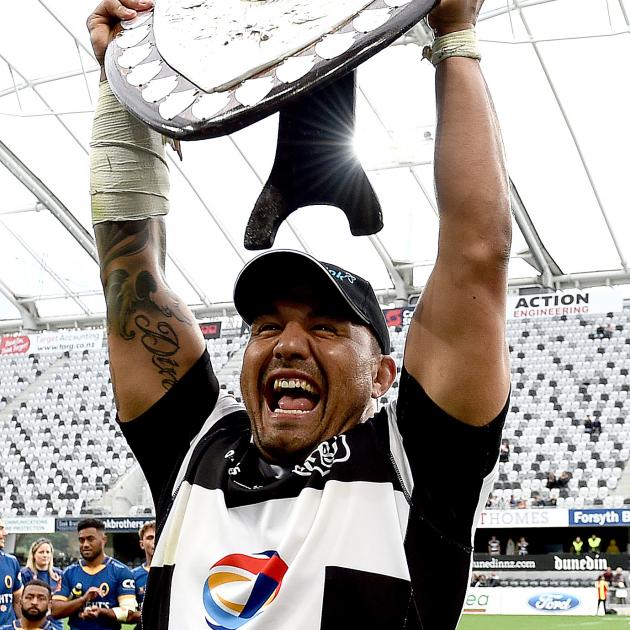 Hawkes Bay hooker Ash Dixon lifts the Ranfurly Shield after his side defeated Otago at Forsyth...