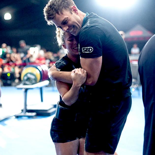 Powerlifter Megan-Li Smith and her coach and partner James Schroder after winning gold at the...