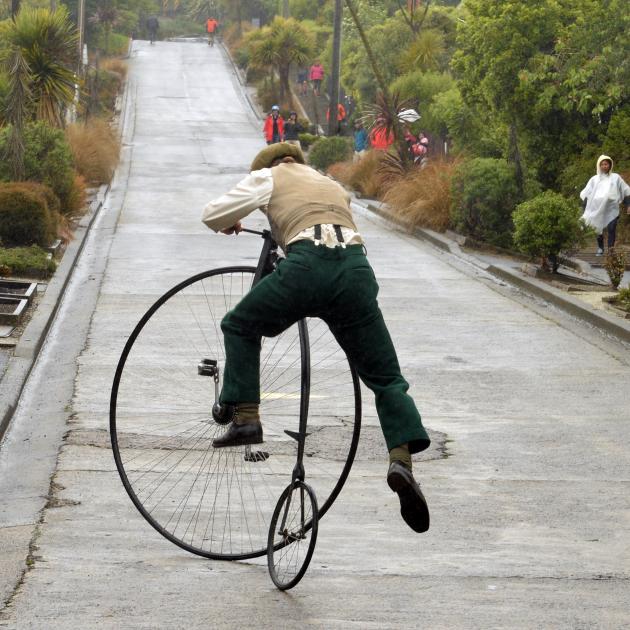 Oliver Briggs attempts to ride up Baldwin St. Photo: Stephen Jaquiery