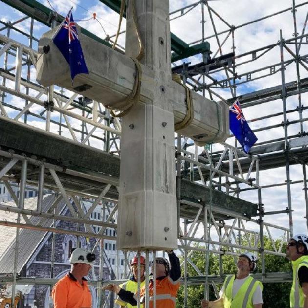 The cross has been placed back on the Citizens’ War Memorial. Photo: Newsline