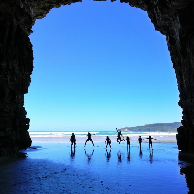 People play in the Cathedral Caves in the Catlins. PHOTO: ODT FILES