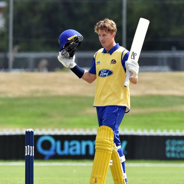 Otago batter Luke Georgeson celebrates after bringing up his century with a four in the Ford...