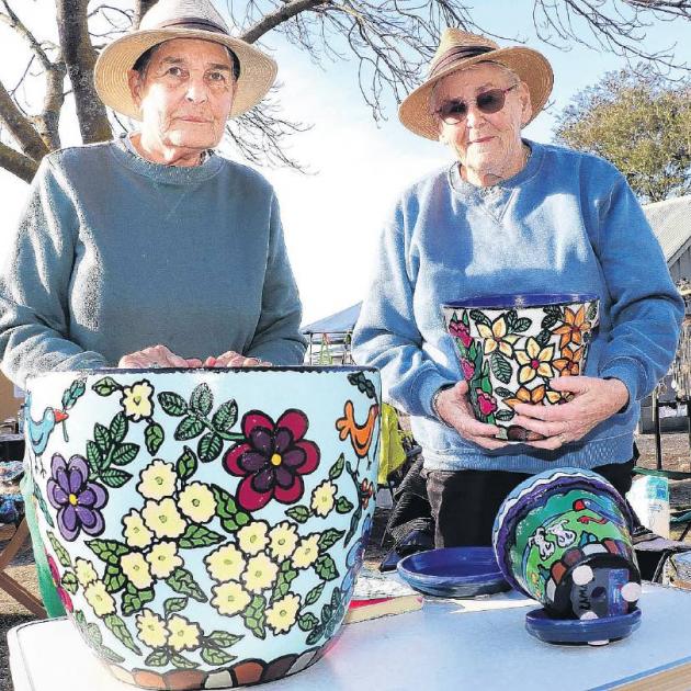 Mari Scott and Jean Laming with their hand decorated ceramic pots at the Amberley Craft Market....