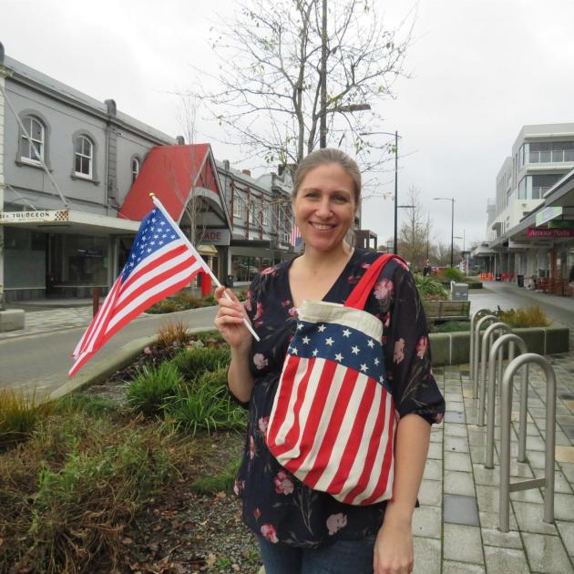 Lydia Maireriki proudly flies a US flag in celebration of Independence Day. Photo: Supplied