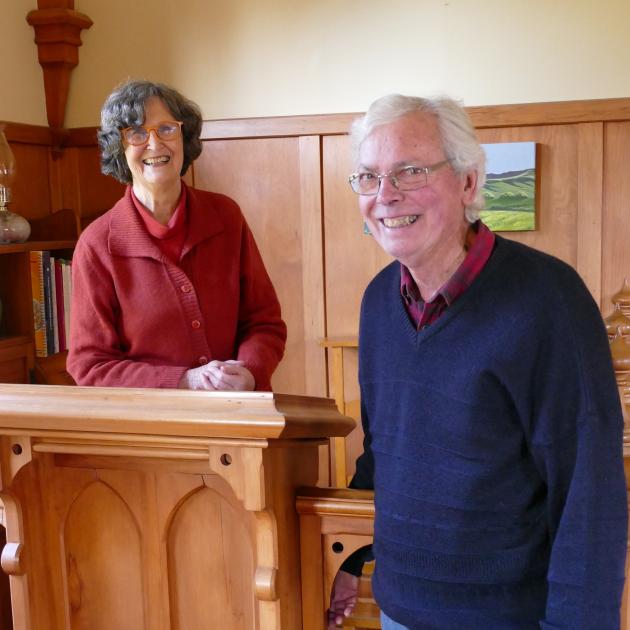 Homeowners Wensley and Art Santure stand at the original pulpit of the converted 1930s...